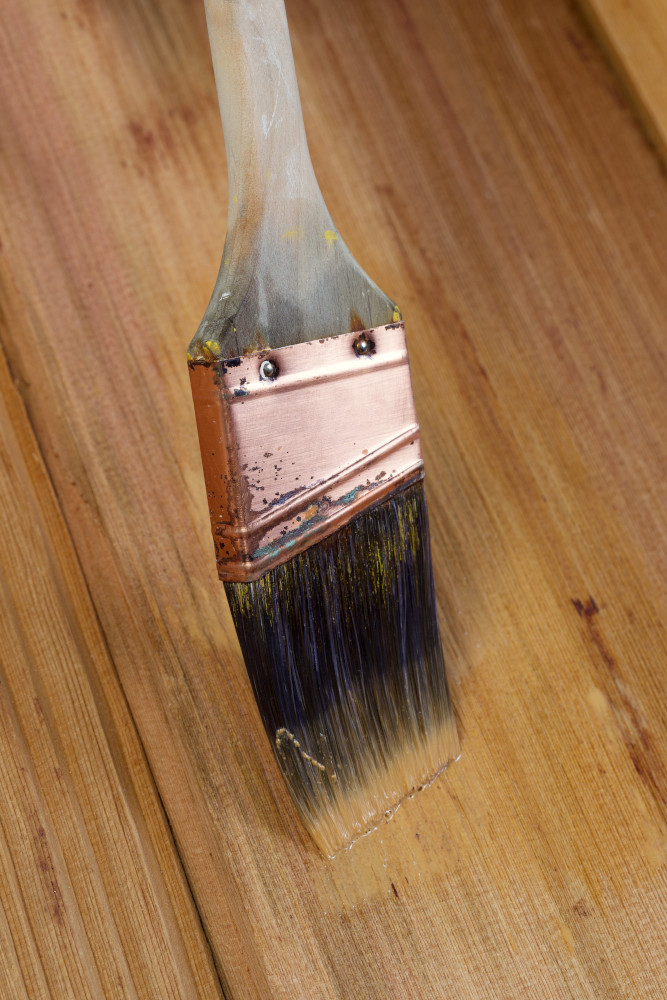 Painting wood sealer on wood